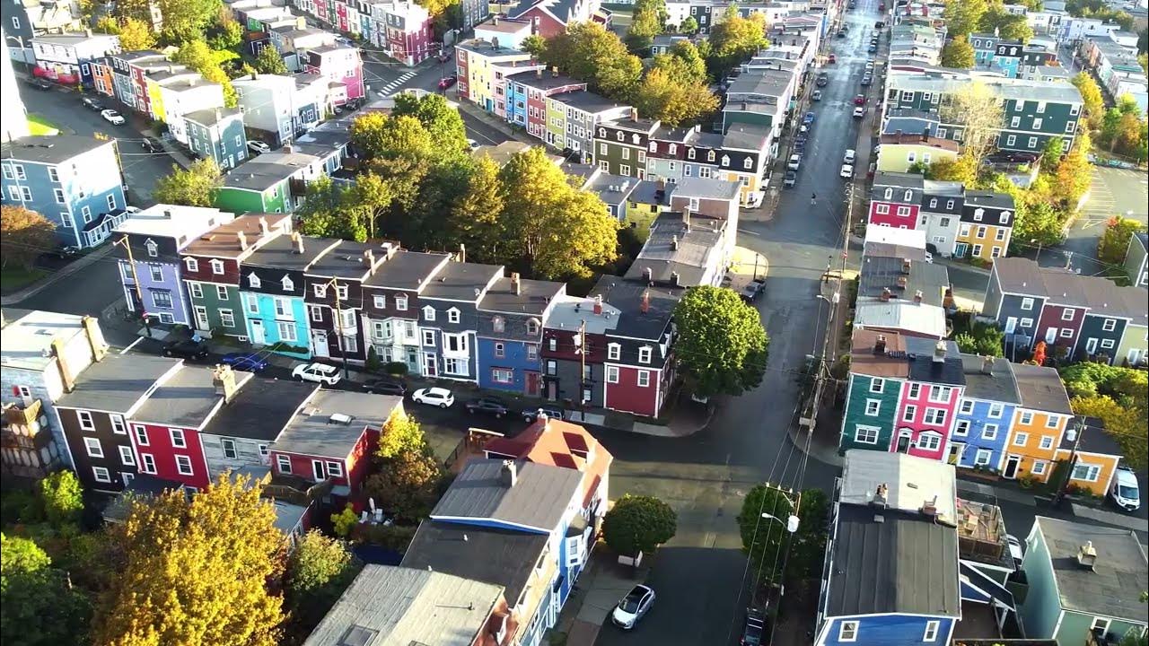 Aerial photo of downtown St. John’s showing colorful row houses contrasted with visible parking areas